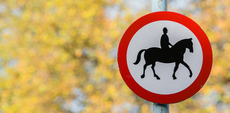 Road sign with horse patrol icon